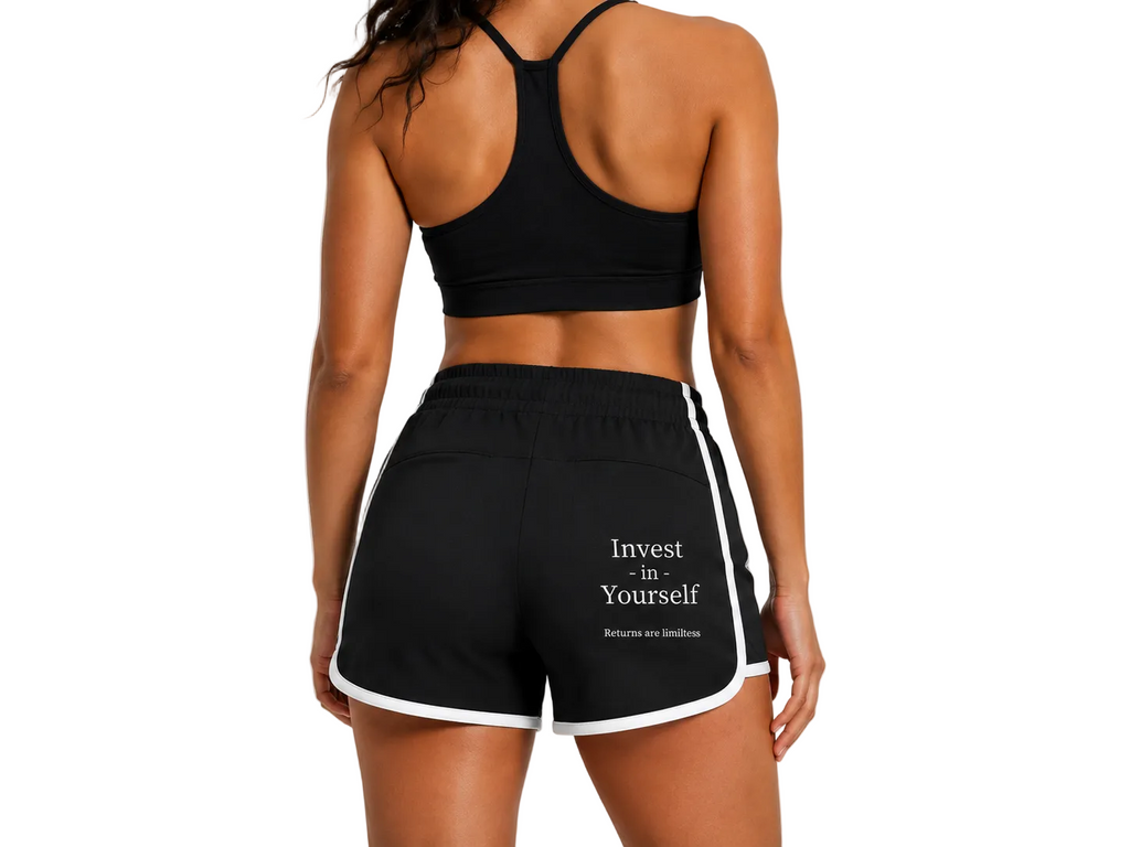 Back view of A.MP black colour block yoga shorts showing the Invest in Yourself print